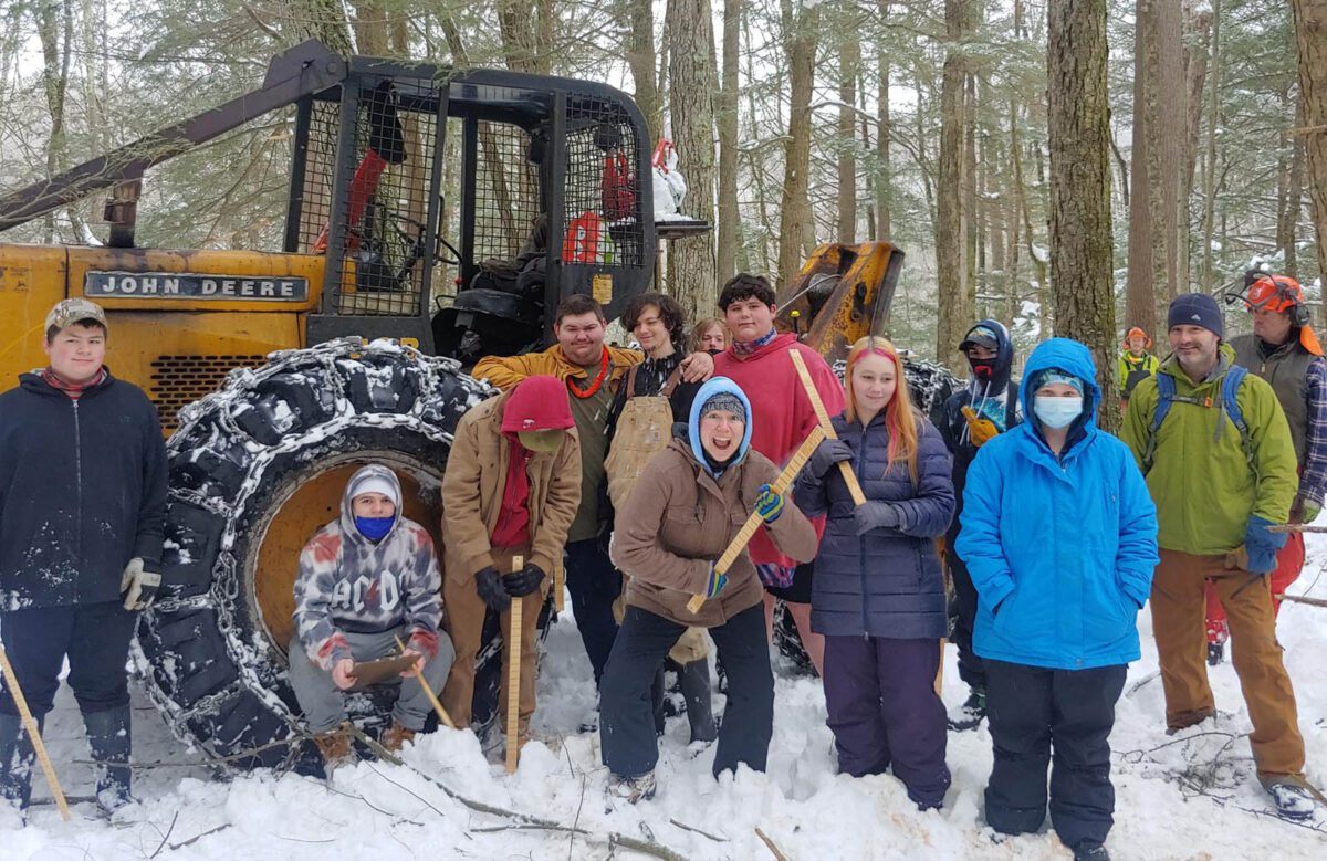 Students in the Lake Champlain Maritime Museum Longboats Program explore the forest with VFF executive director David Brynn.