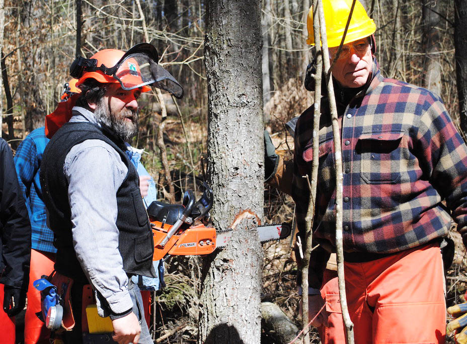 Two men at a chainsaw class