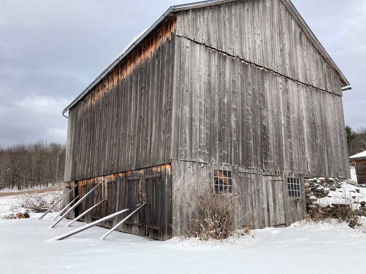 old barn in snow.